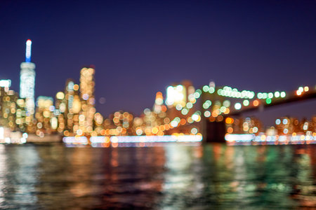 Defocused view of New-York City downtown from Brooklyn at nightの写真素材