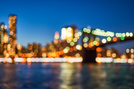 Defocused view of New-York City downtown from Brooklyn at eveningの写真素材