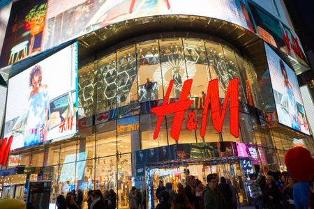 NEW YORK - CIRCA MARCH 2016: Times Square H&M store at night. H & M Hennes & Mauritz AB is a Swedish multinational retail-clothing company, known for its fast-fashion clothing for men, women, teenagers and children.のeditorial素材