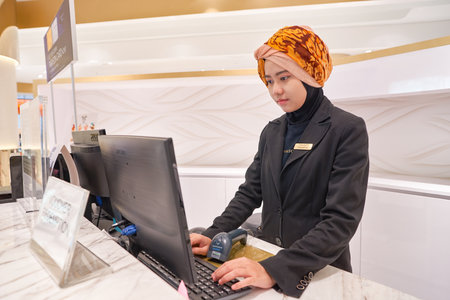 KUALA LUMPUR, MALAYSIA - MAY 09, 2016: indoor portrait of worker at Suria KLCC. Suria KLCC is a shopping mall is located in the Kuala Lumpur City Centre district. It is in the vicinity of the landmark the Petronas Towers.のeditorial素材
