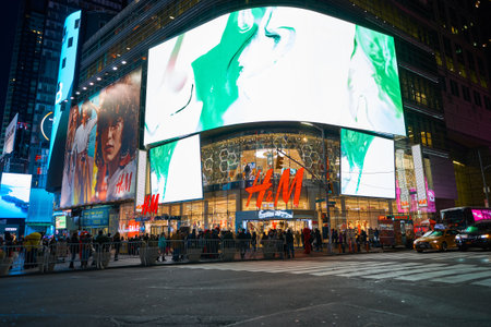 NEW YORK - CIRCA MARCH 2016: Times Square H&M store at night. H & M Hennes & Mauritz AB is a Swedish...