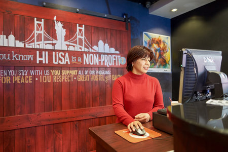 NEW YORK - CIRCA MARCH, 2016: reception in the hostel. Hostels provide budget-oriented, sociable accommodation where guests can rent a bed, usually a bunk bed, in a dormitory and share a bathroom, lounge, and sometimes a kitchen.のeditorial素材