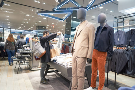 NEW YORK - CIRCA MARCH 2016: interior of Times Square H&M store. H & M Hennes & Mauritz AB is a Swedish multinational retail-clothing company, known for its fast-fashion clothing for men, women, teenagers and children.のeditorial素材