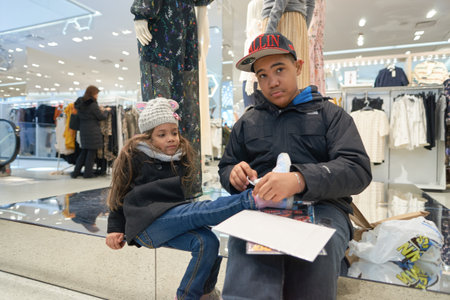 NEW YORK - CIRCA MARCH 2016: children inside of Times Square H&M store. H & M Hennes & Mauritz AB is a Swedish multinational retail-clothing company, known for its fast-fashion clothing for men, women, teenagers and children.のeditorial素材