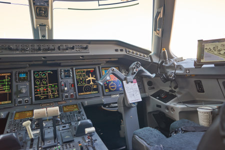 NEW YORK - MARCH 22, 2016: inside of Embraer 190 cockpit. The Embraer E-Jet family is a series of narrow-body medium-range twin-engine jet airliners produced by Brazilian aerospace conglomerate Embraer.のeditorial素材