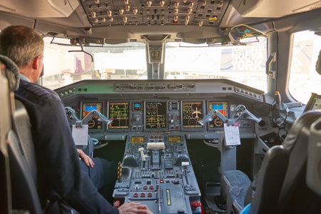 NEW YORK - MARCH 22, 2016: inside of Embraer 190 cockpit. The Embraer E-Jet family is a series of narrow-body medium-range twin-engine jet airliners produced by Brazilian aerospace conglomerate Embraer.のeditorial素材