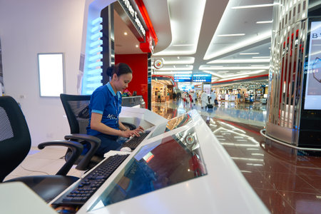 DUBAI, UAE - MARCH 09, 2016: Dubai International Airport staff. Dubai International Airport is the...