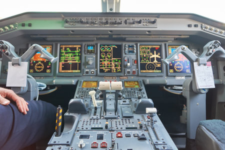 NEW YORK - MARCH 22, 2016: inside of Embraer 190 cockpit. The Embraer E-Jet family is a series of narrow-body medium-range twin-engine jet airliners produced by Brazilian aerospace conglomerate Embraer.のeditorial素材