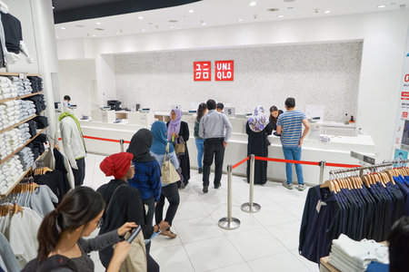 KUALA LUMPUR, MALAYSIA - MAY 09, 2016: Uniqlo store in Suria KLCC. Uniqlo Co., Ltd. is a Japanese...