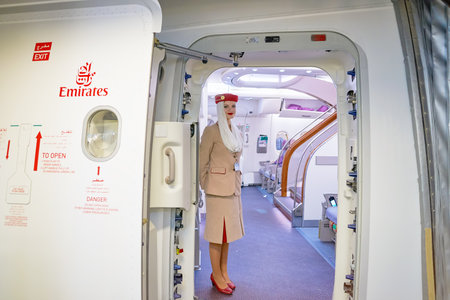 DUBAI, UAE - CIRCA MAY, 2016: Emirates crew member on board of A380. Emirates is one of two flag...