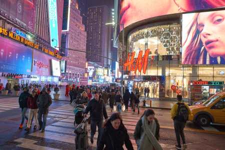 NEW YORK - CIRCA MARCH 2016: Times Square H&M store at night. H & M Hennes & Mauritz AB is a Swedish...