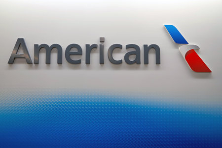 CHICAGO - MARCH 22, 2016: American Airlines logo on the wall at Chicago O'Hare International Airport. American Airlines, Inc. is a major American airline headquartered in Fort Worth, Texas.のeditorial素材