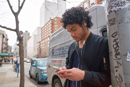 NEW YORK - CIRCA MARCH, 2016: outdoor portrait of young man in New York. The City of New York is the most populous city in the United Statesのeditorial素材