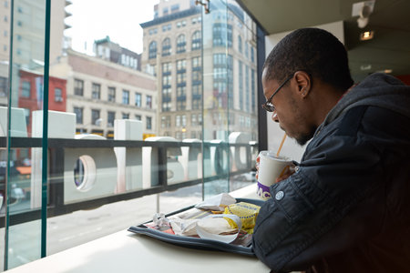 NEW YORK - CIRCA MARCH, 2016: customer in McDonald's restaurant. McDonald's is the world's largest chain of hamburger fast food restaurants, founded in the United States.のeditorial素材