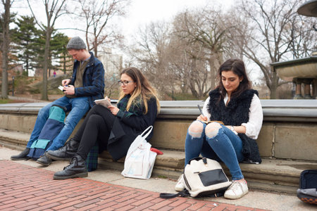 NEW YORK - CIRCA MARCH, 2016: people sit in Central Park. Central Park is an urban park in middle-upper Manhattan, within New York City.のeditorial素材