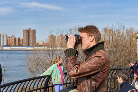 NEW YORK - CIRCA MARCH, 2016: man taking photos in New York. The City of New York, often called New York City or simply New York, is the most populous city in the United Statesのeditorial素材