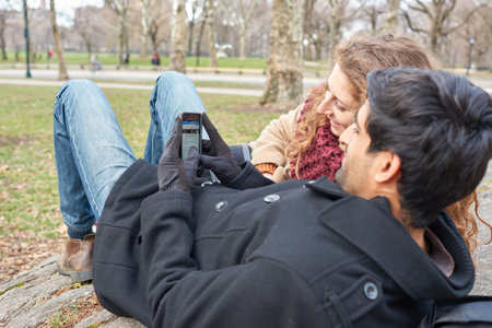 NEW YORK - CIRCA MARCH, 2016: outdoor lifestyle portrait of young people in Central Park. Central Park is an urban park in middle-upper Manhattan, within New York City.のeditorial素材