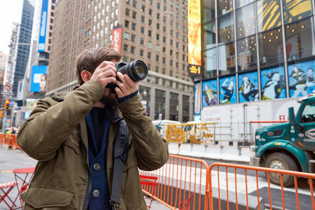 NEW YORK - CIRCA MARCH, 2016: man taking photos in New York. The City of New York, often called New York City or simply New York, is the most populous city in the United Statesのeditorial素材
