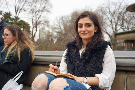 NEW YORK - CIRCA MARCH, 2016: outdoor portrait of young woman in Central Park. Central Park is an urban park in middle-upper Manhattan, within New York City.のeditorial素材