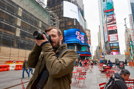 NEW YORK - CIRCA MARCH, 2016: man taking photos in New York. The City of New York, often called New York City or simply New York, is the most populous city in the United Statesのeditorial素材