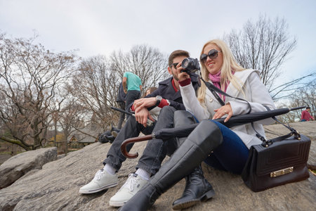 NEW YORK - CIRCA MARCH, 2016: outdoor lifestyle portrait of young people in Central Park. Central Park is an urban park in middle-upper Manhattan, within New York City.のeditorial素材