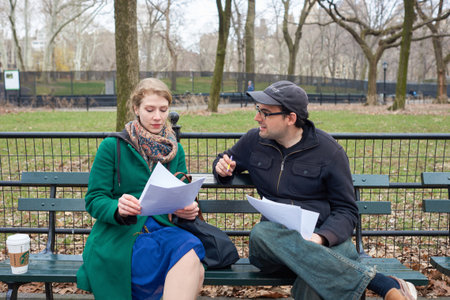 NEW YORK - CIRCA MARCH, 2016: people sit on the bench in Central Park. Central Park is an urban park in middle-upper Manhattan, within New York City.のeditorial素材
