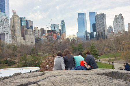 NEW YORK - CIRCA MARCH, 2016: outdoor lifestyle portrait of young people in Central Park. Central Park is an urban park in middle-upper Manhattan, within New York City.のeditorial素材