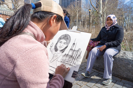 NEW YORK - CIRCA MARCH, 2016: woman posing for painter in New York. The City of New York is the most...