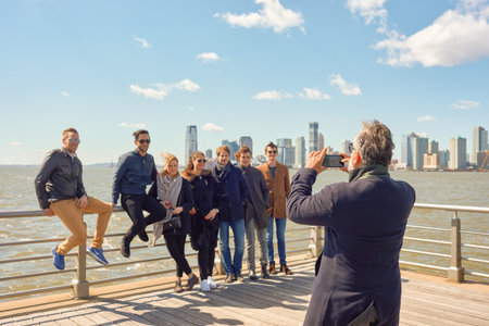 NEW YORK - CIRCA MARCH, 2016: man taking photo of people in New York. The City of New York is the most populous city in the United Statesのeditorial素材