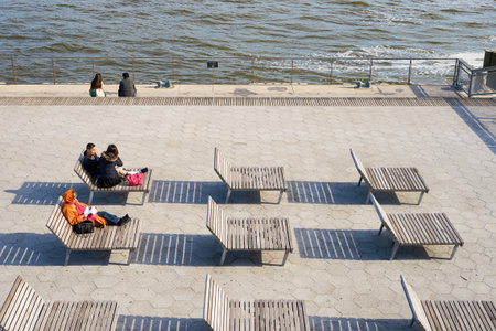 NEW YORK - MARCH 17, 2016: Pier 15 at daytime. Pier 15 is located east of South Street and FDR Drive in Lower Manhattan, New York City.のeditorial素材
