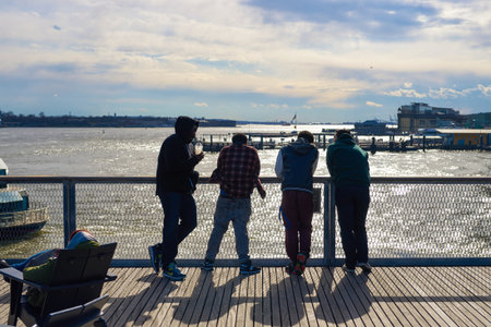 NEW YORK - MARCH 17, 2016: group of people at Pier 15 at daytime. Pier 15 is located east of South Street and FDR Drive in Lower Manhattan, New York City.のeditorial素材