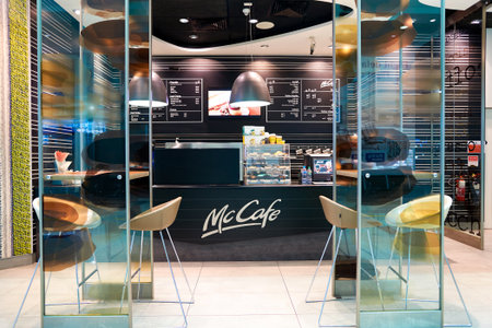 DUBAI, UAE - APRIL 08, 2016: interior of McCafe in Dubai International Airport. McCafe is a coffee-house-style food and drink chain, owned by McDonald's.のeditorial素材