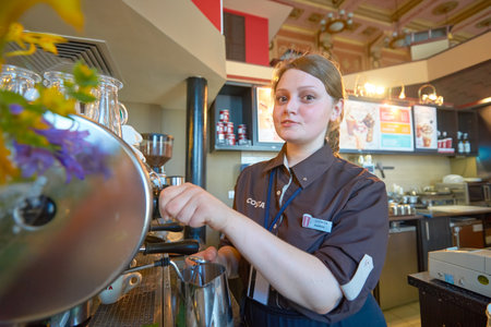 MOSCOW, RUSSIA - JUNE 26, 2016: barista in Costa Coffee. Costa Coffee is a British multinational coffeehouse company. It is the second largest coffeehouse chain in the world behind Starbucks.のeditorial素材