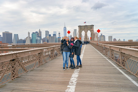 NEW YORK - CIRCA MARCH, 2016: view from the pedestrian walkway of the Brooklyn Bridge. The Brooklyn Bridge is connects the boroughs of Manhattan and Brooklyn by spanning the East River.のeditorial素材