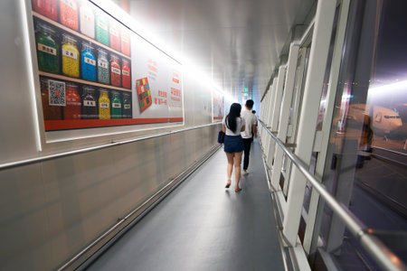 SHENZHEN, CHINA - CIRCA MAY, 2016: people boarding the airplane at Shenzhen Bao'an International Airport. It is located near Huangtian and Fuyong villages in Bao'an District, Shenzhen, Guangdong, China.のeditorial素材