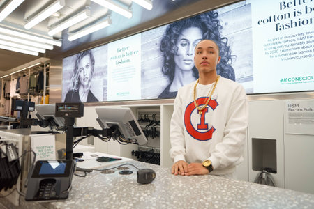 CHICAGO, IL - MARCH 24, 2016:  indoor portrait of workers at H&M store. H & M Hennes & Mauritz AB is a Swedish multinational retail-clothing company, known for its fast-fashion clothing for men, women, teenagers and children.のeditorial素材