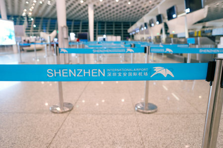 SHENZHEN, CHINA - CIRCA MAY, 2016: close-up shot of belt in check-in area at Shenzhen Bao'an International Airport. It is located near Huangtian and Fuyong villages in Bao'an District, Shenzhen, Guangdong, China.のeditorial素材