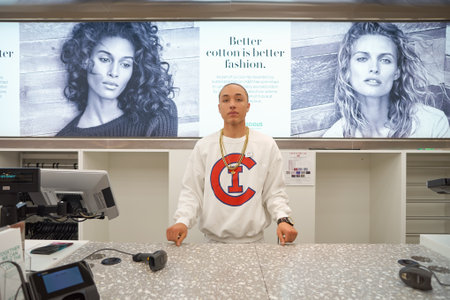 CHICAGO, IL - MARCH 24, 2016:  indoor portrait of workers at H&M store. H & M Hennes & Mauritz AB is a Swedish multinational retail-clothing company, known for its fast-fashion clothing for men, women, teenagers and children.のeditorial素材