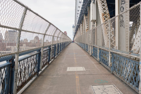 NEW YORK - CIRCA MARCH, 2016: Manhattan Bridge Pedestrian Walkway. The Manhattan Bridge is a suspension bridge that crosses the East River in New York Cityのeditorial素材