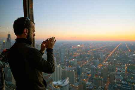 CHICAGO, IL - CIRCA MARCH, 2016: visitor at John Hancock Center's observatory. The John Hancock Center is a supertall skyscraper at 875 North Michigan Avenue, Chicago.のeditorial素材