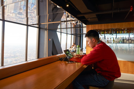CHICAGO, IL - CIRCA MARCH, 2016: visitor at John Hancock Center's observatory. The John Hancock Center is a supertall skyscraper at 875 North Michigan Avenue, Chicago.のeditorial素材