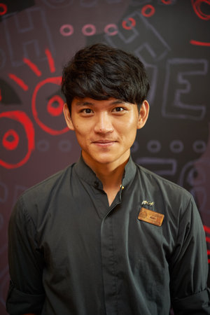 SHENZHEN, CNINA - JUNE 10, 2015: portrait of barista at McCafe. McCafe is a coffee-house-style food and drink chain, owned by McDonald'sのeditorial素材