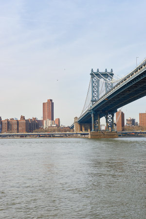 NEW YORK - CIRCA MARCH, 2016: Manhattan Bridge in the daytime. The Manhattan Bridge is a suspension bridge that crosses the East River in New York Cityのeditorial素材