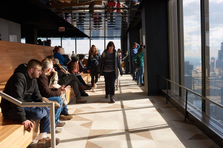 CHICAGO, IL - CIRCA MARCH, 2016: visitors at John Hancock Center's observatory. The John Hancock Center is a supertall skyscraper at 875 North Michigan Avenue, Chicago.のeditorial素材