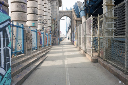 NEW YORK - CIRCA MARCH, 2016: Manhattan Bridge Pedestrian Walkway. The Manhattan Bridge is a suspension bridge that crosses the East River in New York Cityのeditorial素材