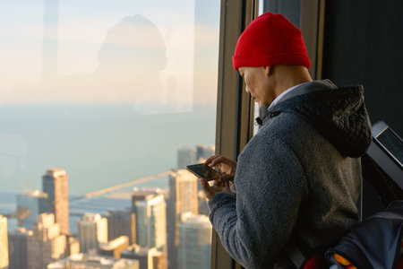 CHICAGO, IL - CIRCA MARCH, 2016: visitor at John Hancock Center's observatory. The John Hancock Center is a supertall skyscraper at 875 North Michigan Avenue, Chicago.のeditorial素材