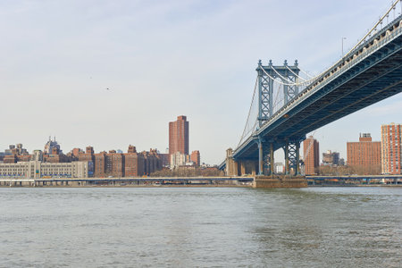 NEW YORK - CIRCA MARCH, 2016: Manhattan Bridge in the daytime. The Manhattan Bridge is a suspension bridge that crosses the East River in New York Cityのeditorial素材