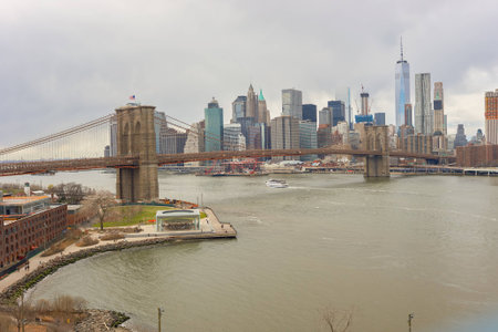 NEW YORK - CIRCA MARCH, 2016: Brooklyn Bridge in the daytime. The Brooklyn Bridge is connects the boroughs of Manhattan and Brooklyn by spanning the East River.のeditorial素材