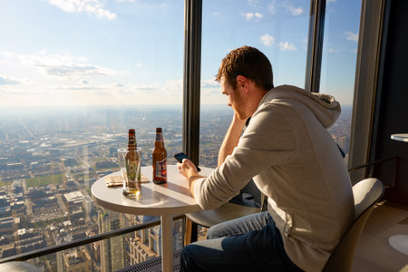 CHICAGO, IL - CIRCA MARCH, 2016: visitor at John Hancock Center's observatory. The John Hancock Center is a supertall skyscraper at 875 North Michigan Avenue, Chicago.のeditorial素材