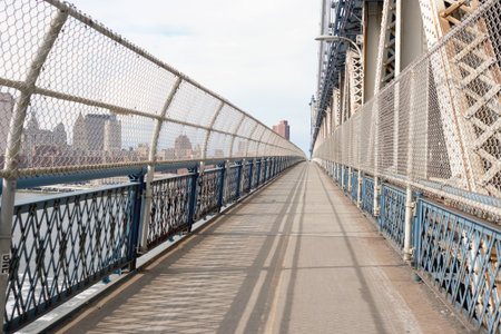 NEW YORK - CIRCA MARCH, 2016: Manhattan Bridge Pedestrian Walkway. The Manhattan Bridge is a suspension bridge that crosses the East River in New York Cityのeditorial素材